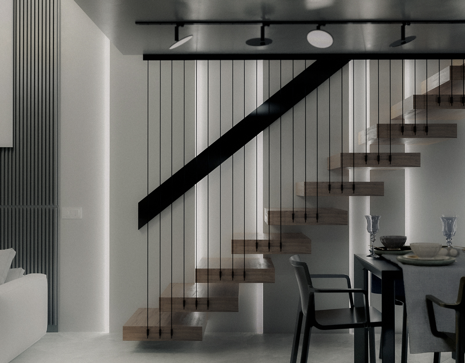 Staircase connecting living space and mezzanine. Scala di collegamento tra zona giorno e soppalco.