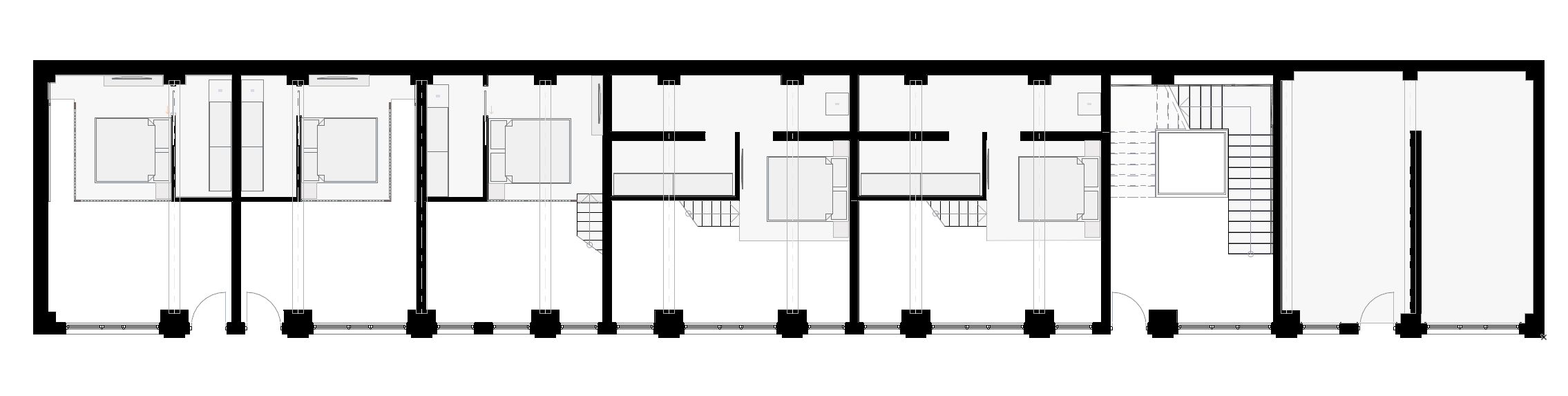 Mezzanine level plan of duplex apartments within converted industrial building. Planimetria del livello soppalcato degli appartamenti duplex in edificio industriale riconvertito.