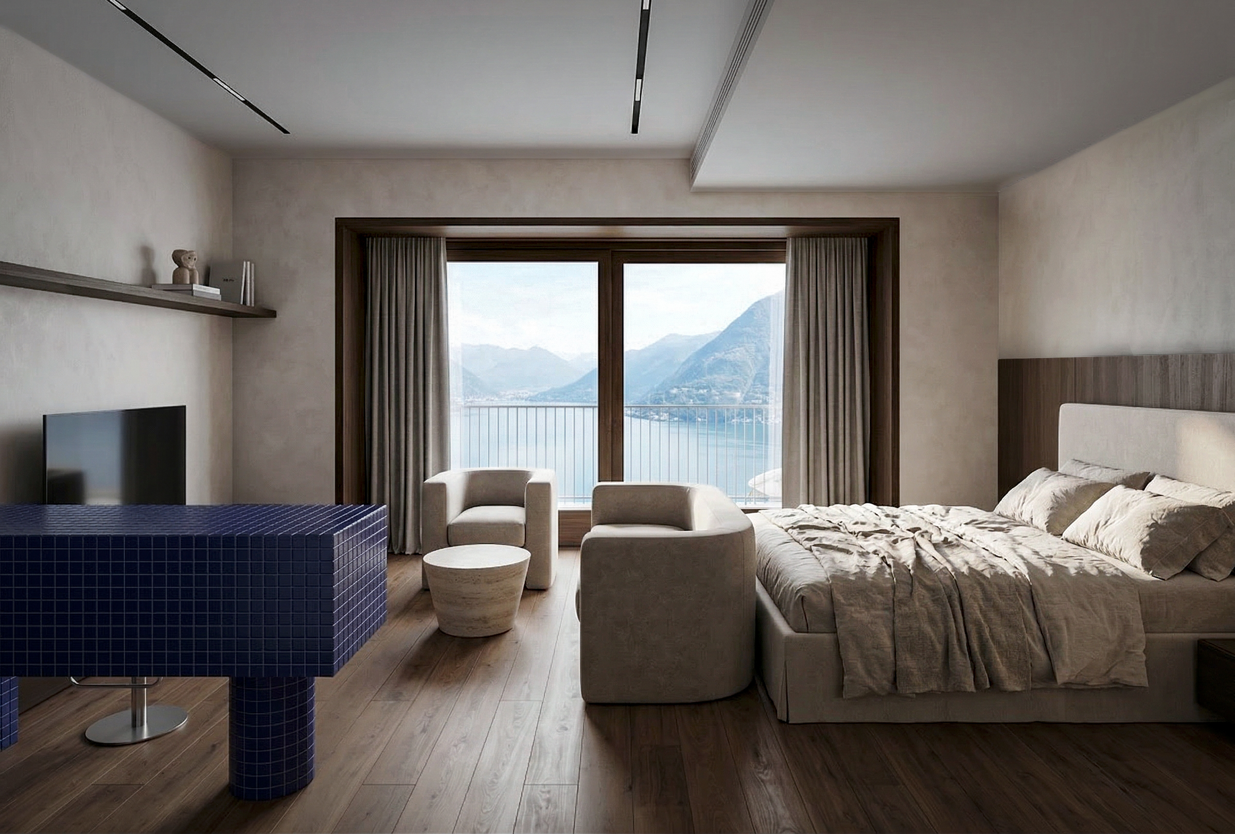 Vista dell’open space verso le finestre panoramiche, con zona notte, soggiorno e cucina integrata. View through the open-plan apartment towards the panoramic windows, with integrated sleeping, living and kitchen areas.